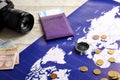 Compass, money, passport, camera and map on wooden background. Travel concept Royalty Free Stock Photo