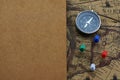 Compass and notebook on blur vintage world map, journey concept, copy space Royalty Free Stock Photo