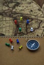 Compass and notebook on blur vintage world map, journey concept, copy space Royalty Free Stock Photo