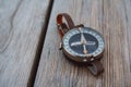 Compass on old wood background with copy space for text Royalty Free Stock Photo