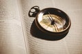 Compass on open bible Royalty Free Stock Photo