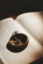 Compass on open bible Royalty Free Stock Photo
