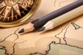 Compass and pencils on old map Royalty Free Stock Photo