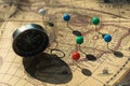 Compass and pin point marking with vintage map background Royalty Free Stock Photo