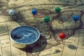 Compass and pin point marking with vintage map background Royalty Free Stock Photo