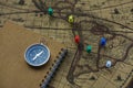 Compass and notebook on blur vintage world map, journey concept, copy space Royalty Free Stock Photo