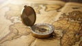 Compass resting on an antiqued world map showcasing a classic navigation Royalty Free Stock Photo