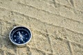 Compass on sand track Royalty Free Stock Photo