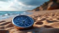 Compass on sandy beach near ocean, showing direction Royalty Free Stock Photo