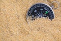 Compass in the sea sand on beach background with copy space for add text message or use components for design. Summer Travel