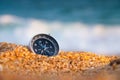 compass on sea sand and place for text. close up of navigation device on sandy beach without people, top view Royalty Free Stock Photo