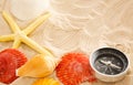 Compass, seastar and seashells in sand Royalty Free Stock Photo