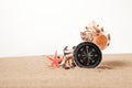 Compass, seastar and seashells in sand closeup Royalty Free Stock Photo