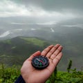 Compass showing the direction in nature and forest