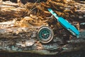 Compass and survival knife on an old rotten stump.A tool for Hiking and survival. Royalty Free Stock Photo