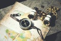 Compass and telescope on map vintage style