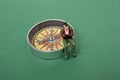 Compass tool with a man fiigurine on