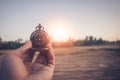 Compass of tourists on mountain at sunset sky Royalty Free Stock Photo