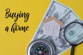 Yellow background written with text BUYING A HOME Royalty Free Stock Photo