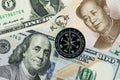 Compass on US America Dollar and Chinese Yuan banknotes using as tariff or trade war negotiation or future direction between the