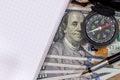 Compass on usa hundred dollars with note, pen. Royalty Free Stock Photo