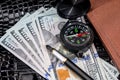 Compass on usa hundred dollars with note, pen Royalty Free Stock Photo