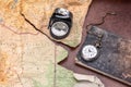 Compass vintage map torn with pocket watch on ancient diary Royalty Free Stock Photo