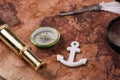 Compass, white anchor, nib and telescope