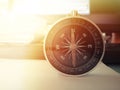 Compass on white paper surface point to the north for business and financial concept with blurred image background. Royalty Free Stock Photo