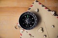 Compass on wooden background with space for text Royalty Free Stock Photo