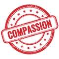 COMPASSION text on red grungy round rubber stamp