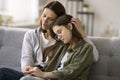 Compassionate young mother comforting depressed sad teen girl Royalty Free Stock Photo