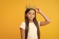 Compelling baby. Kid wear golden crown symbol of princess. Girl cute baby wear crown while stand yellow background Royalty Free Stock Photo