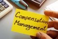 Compensation Management sign on a memo stick Royalty Free Stock Photo
