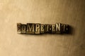 COMPETENT - close-up of grungy vintage typeset word on metal backdrop