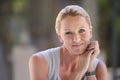 Competent and content. Cropped portrait of an attractive businesswoman sitting in the office. Royalty Free Stock Photo