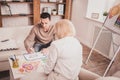 Competent therapist analyzing picture with her colleague