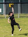 Competing in high school softball game Royalty Free Stock Photo