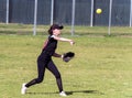 Competing in high school softball game Royalty Free Stock Photo