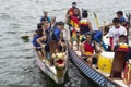 Competing teams of people embark on Sports Native Row Dragon head Boats during Dragon Cup Competition.