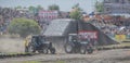 Competition for agricultural tractors on the green meadow