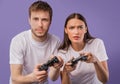 Young serious couple playing video games at studio Royalty Free Stock Photo