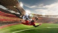 Professional american football players in motion and action with ball during match over 3 D model of grand arena Royalty Free Stock Photo