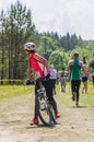 Competition in progress. Cyclist looking back on the track