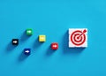 Competition to achieve business goals. Goal setting, performance and strategy. Colorful cubes with target goal and arrow symbols Royalty Free Stock Photo