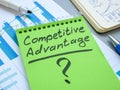 Competitive advantage sign on a green notepad. Royalty Free Stock Photo