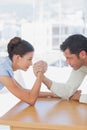 Competitive business people arm wrestling Royalty Free Stock Photo