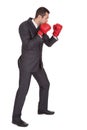 Competitive businessman in boxing gloves