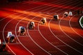 Competitive Sprinters Lined Up for the Start of 200m Race on the Athletic Track at an International Event