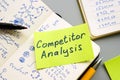 Competitor analysis inscription and handwritten data on the sheets.